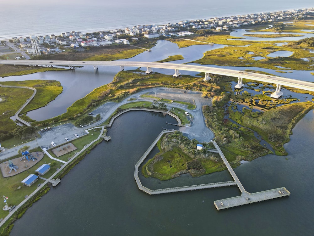 an aerial view of a bridge over a body of water