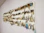 A variety of colorful fishing lures displayed neatly on a rustic table.