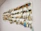 An assortment of colorful fishing lures displayed neatly on a rustic table.