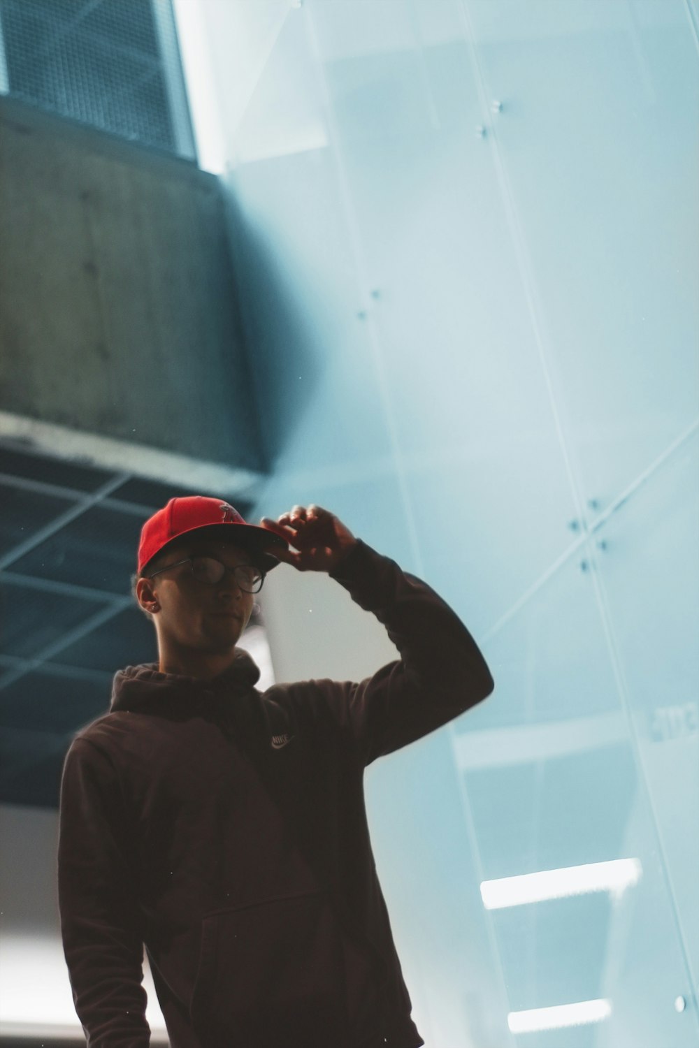 a man wearing a red hat and glasses