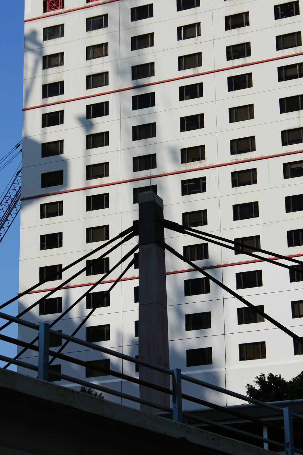 a tall white building with lots of windows