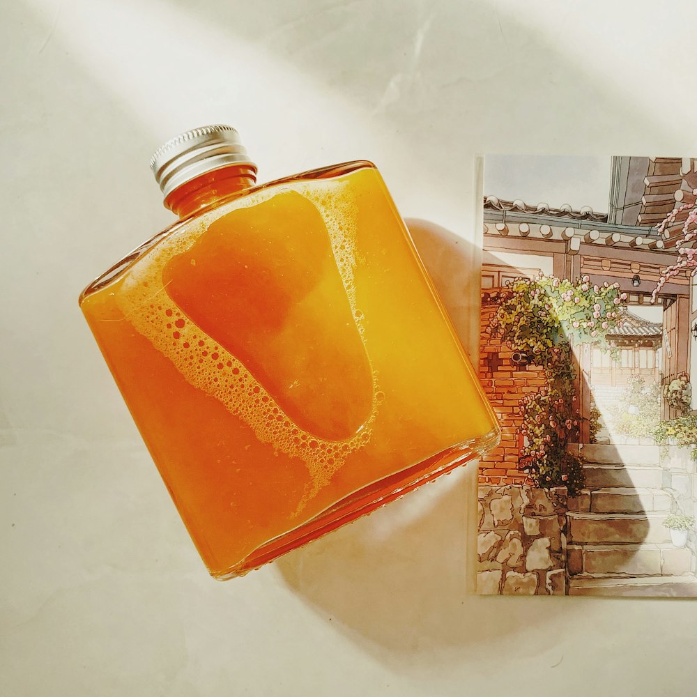 a bottle of liquid sitting on top of a table