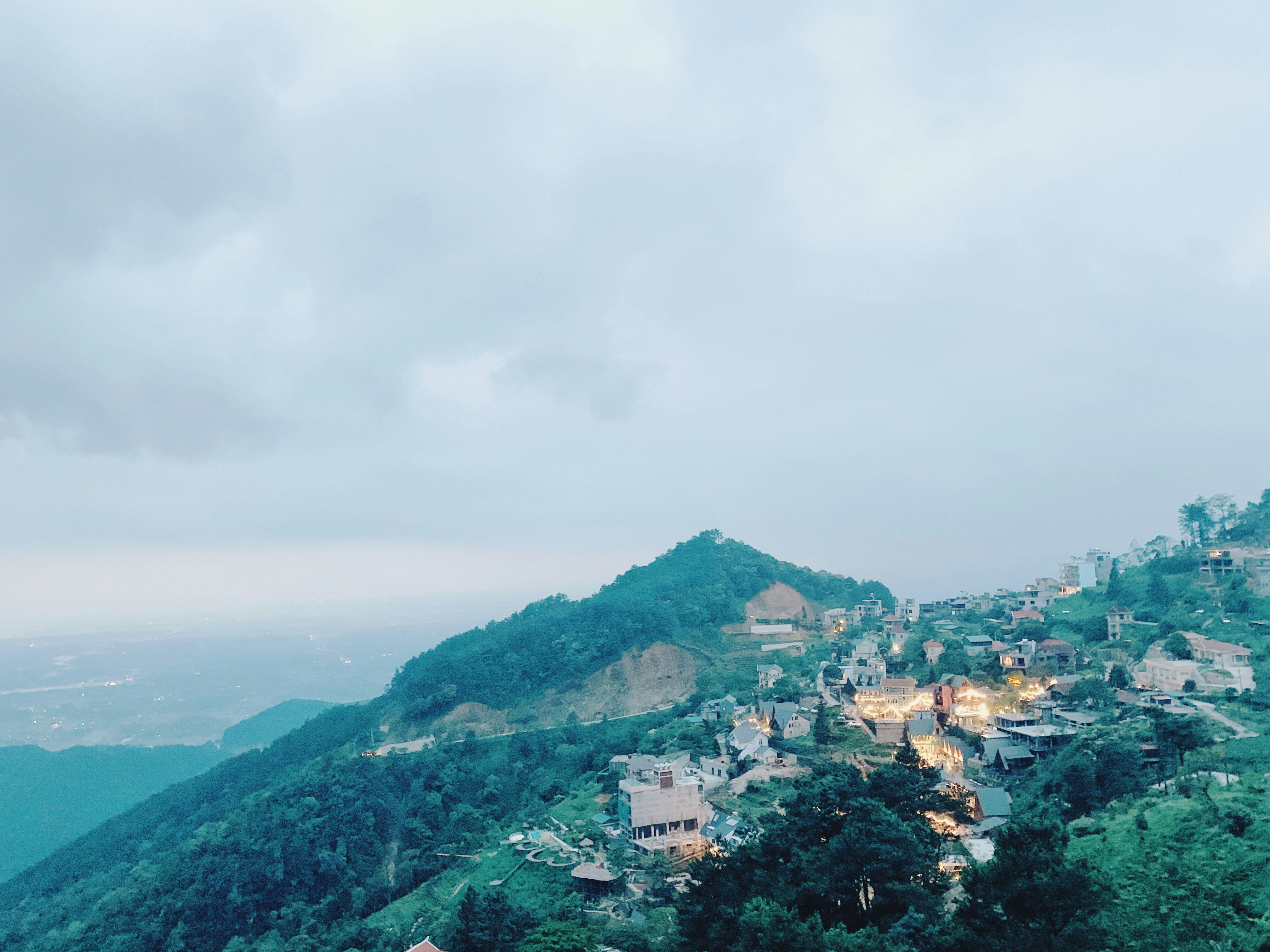 a view of a town on a mountain side