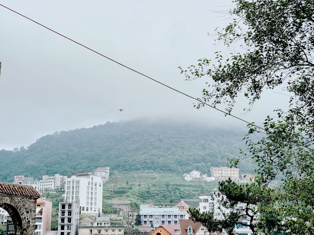 a view of a city with a mountain in the background