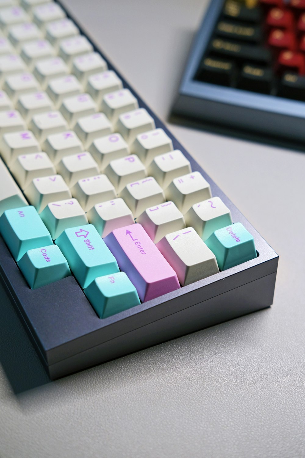 a computer keyboard sitting on top of a table