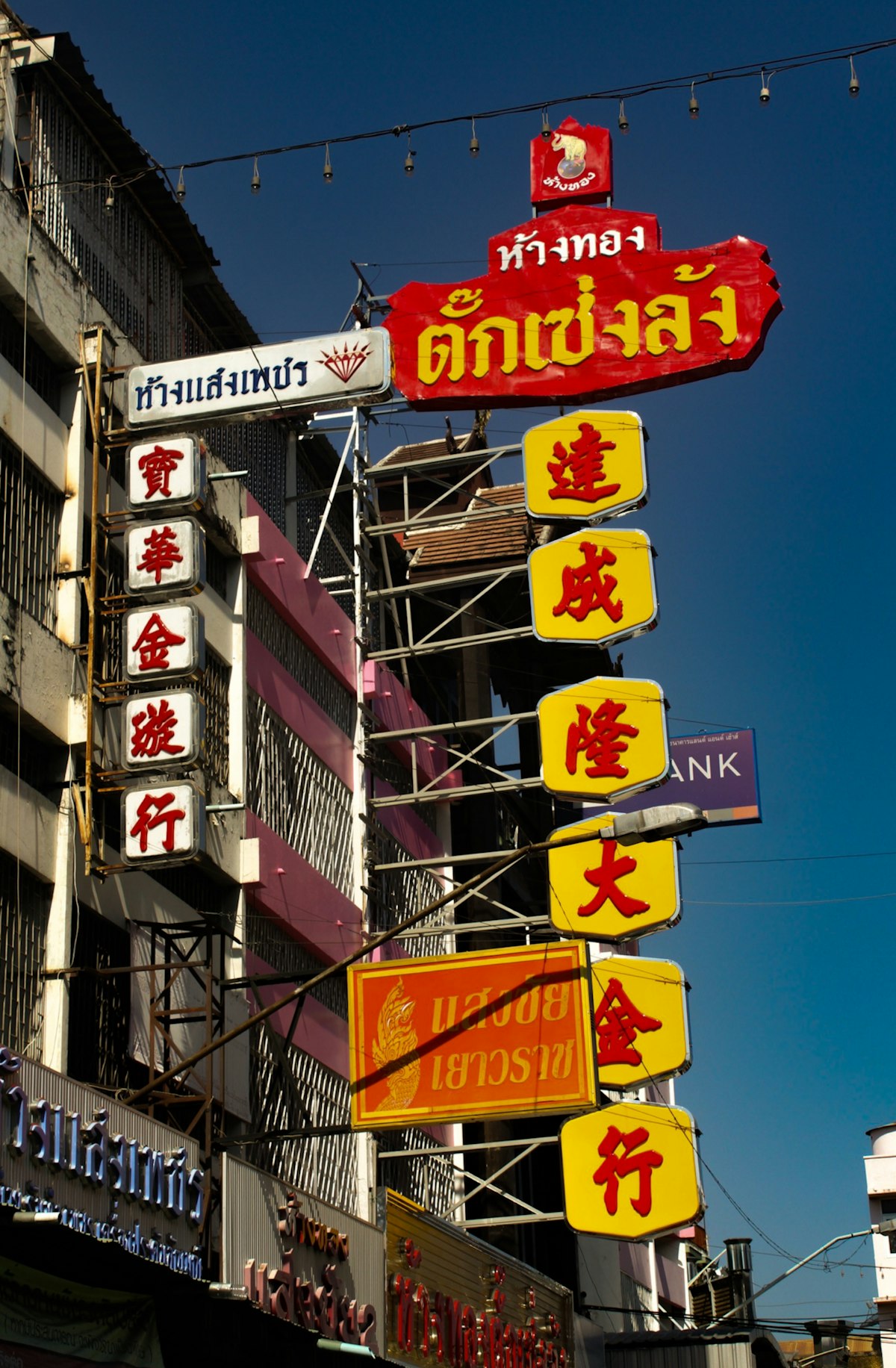Chang Khlan Chiang Mai — illuminated market signs at the Waroros commercial district near the Night Bazaar