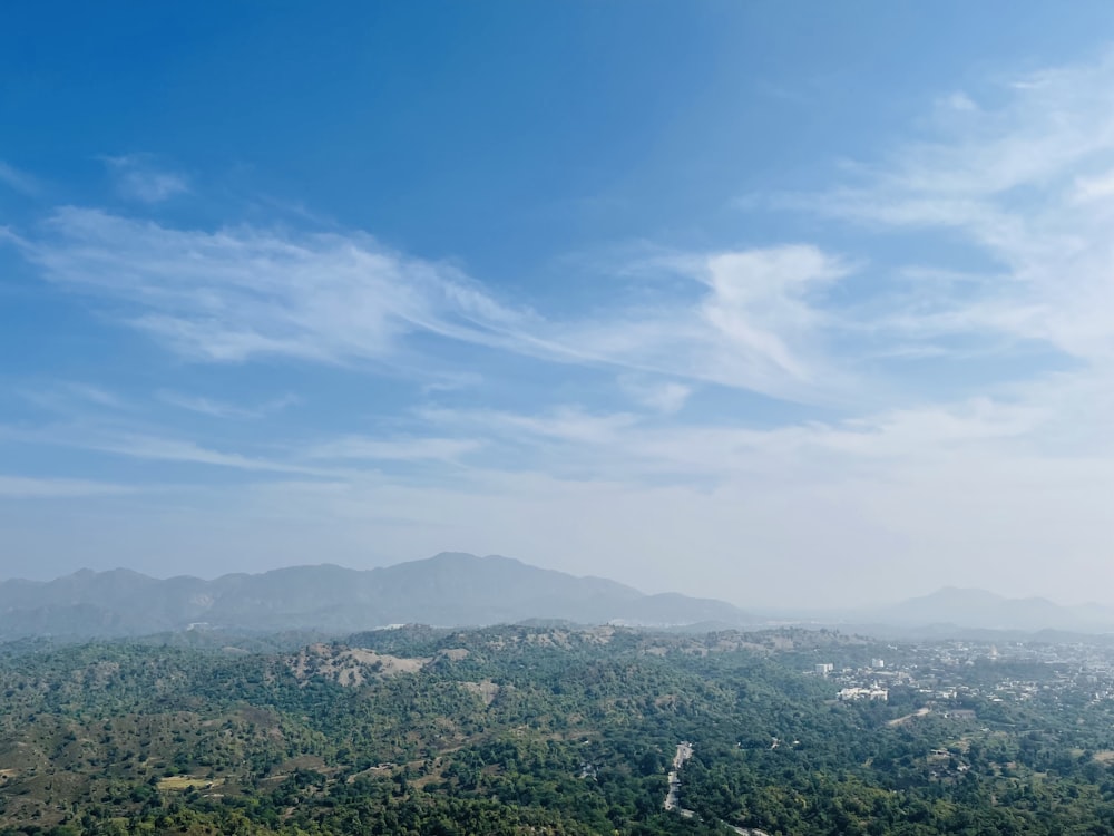 a view of a mountain range with a blue sky