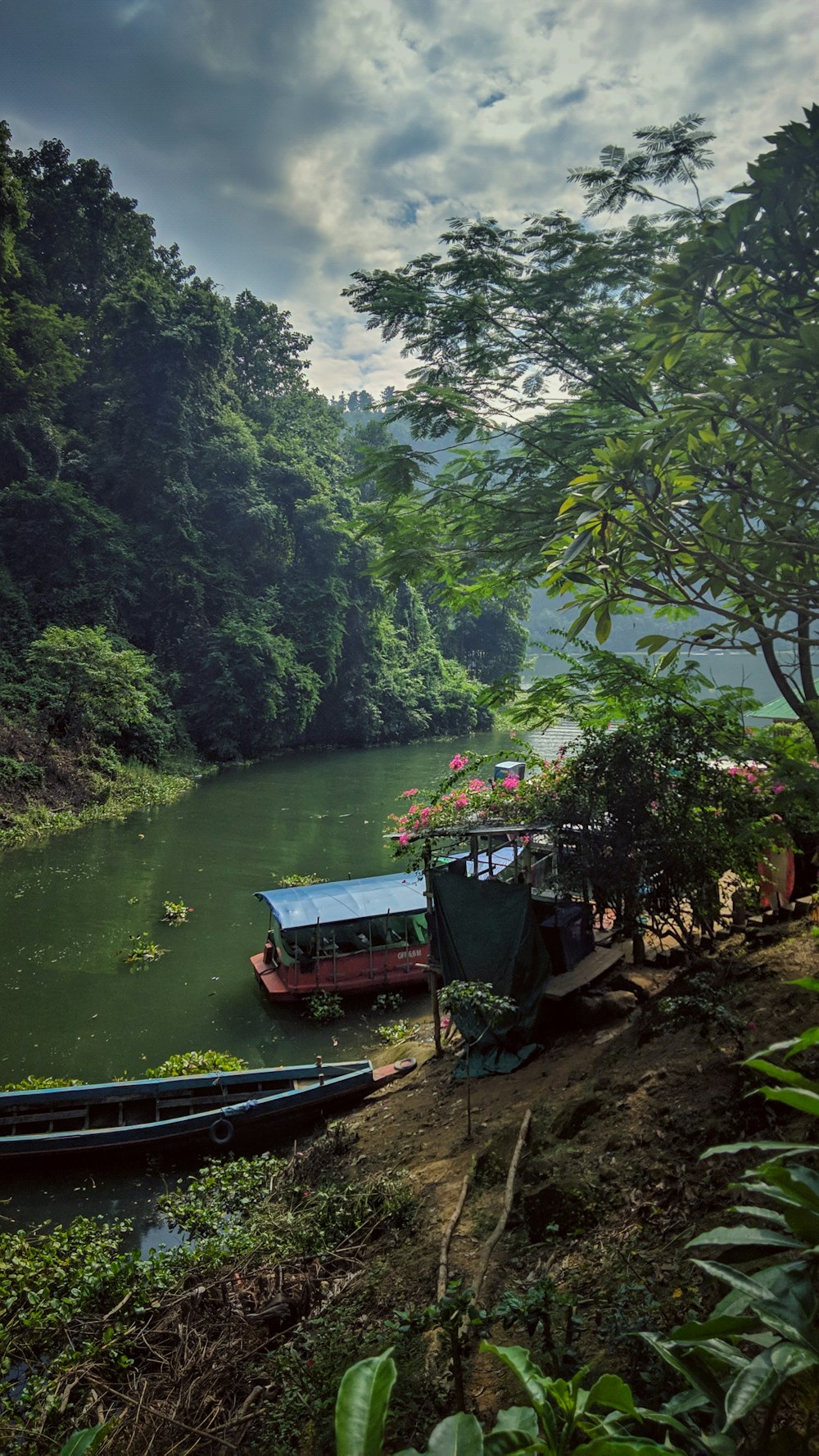 a couple of boats that are sitting in the water