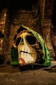 a fake skull with a green cloth covering it's face