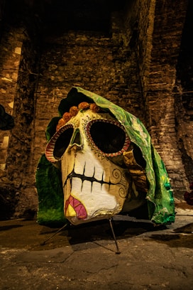 a fake skull with a green cloth covering it's face