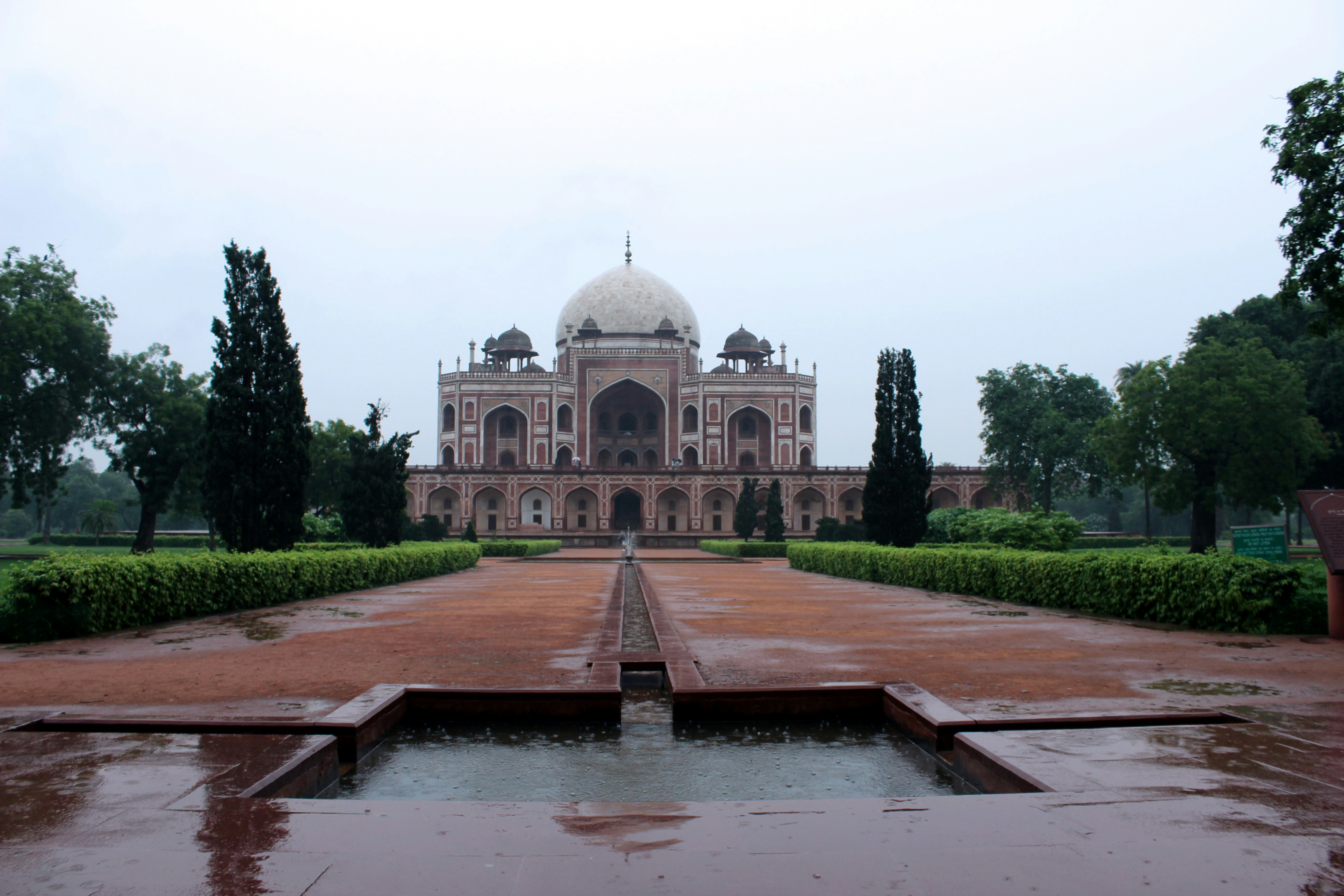 a large building with a fountain in front of it