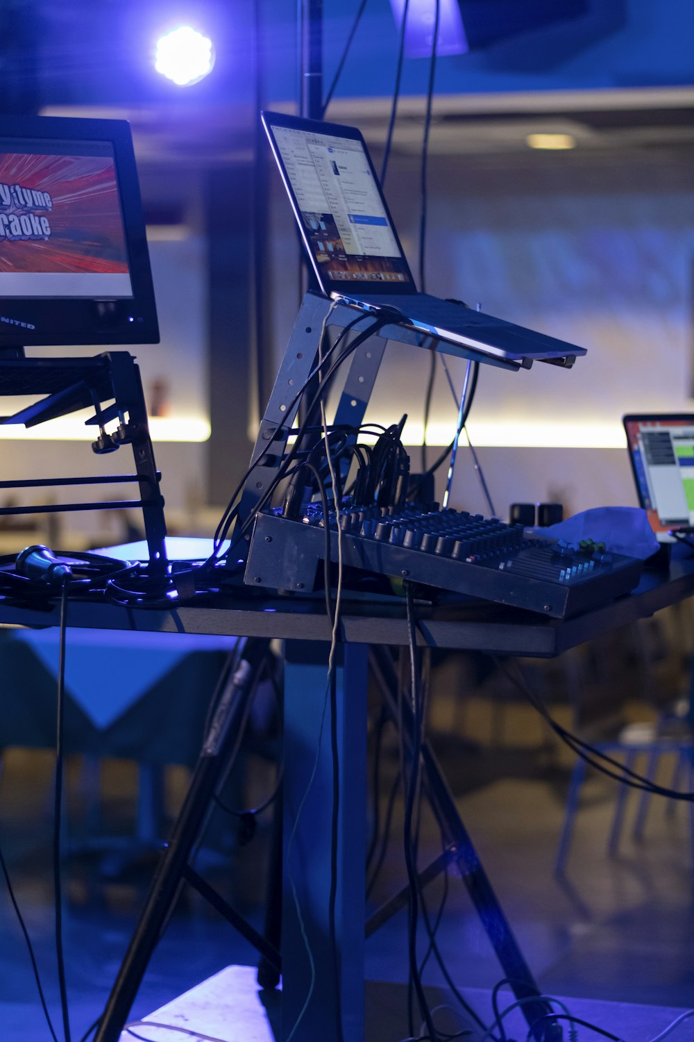 a laptop computer sitting on top of a table