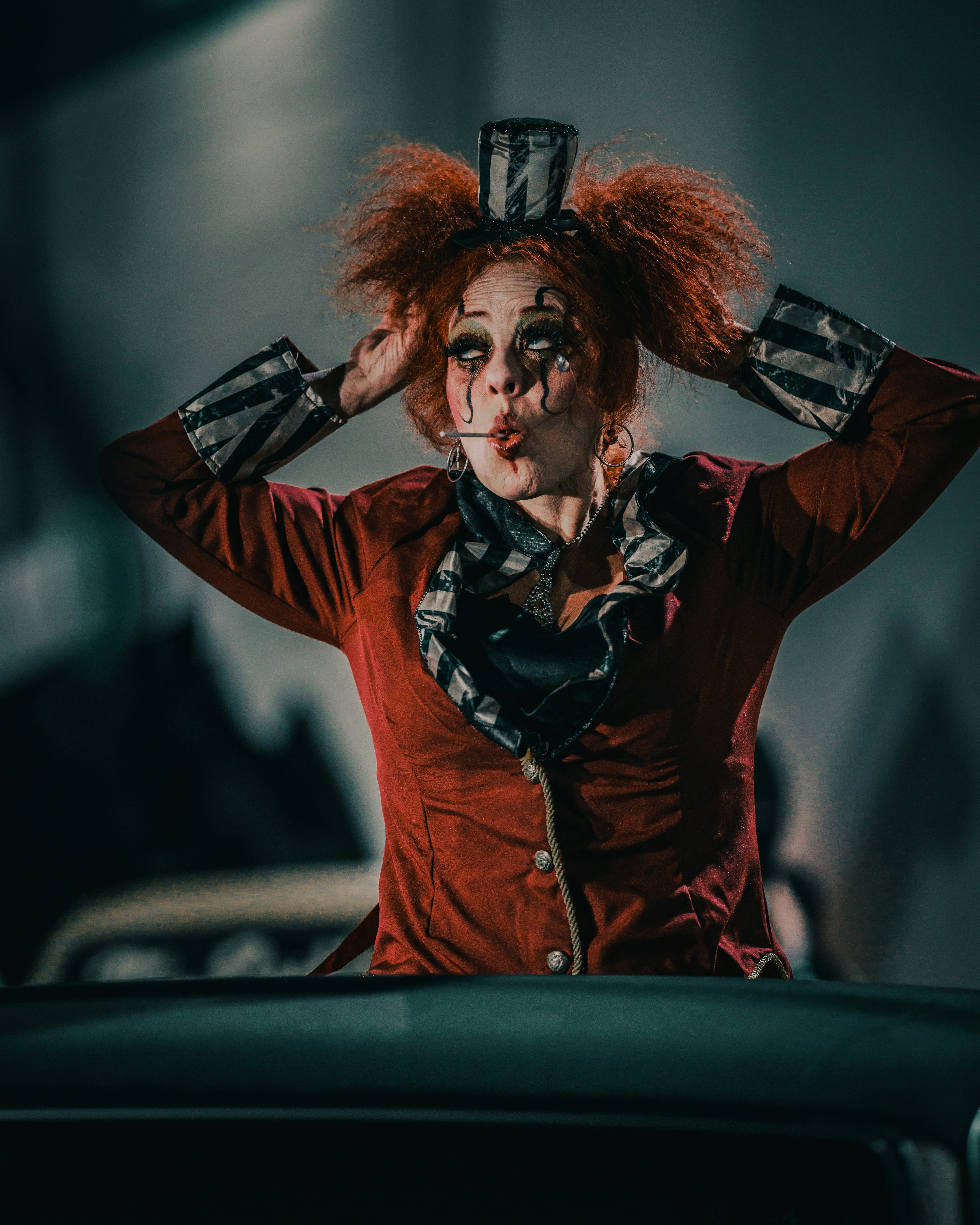 A woman with red hair wearing a clown makeup photo – Free Human Image ...