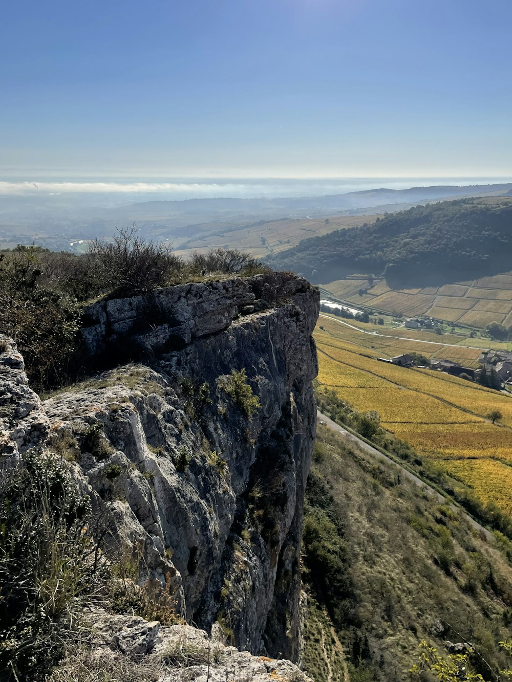 a person standing on top of a cliff