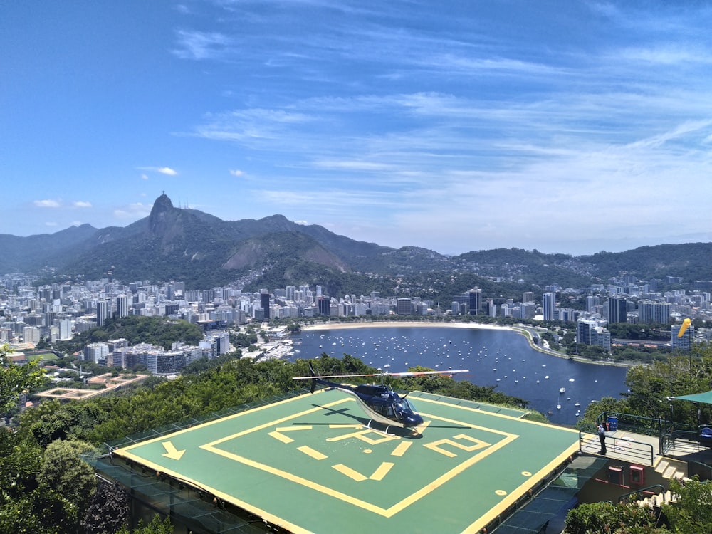 a helicopter sitting on top of a tennis court