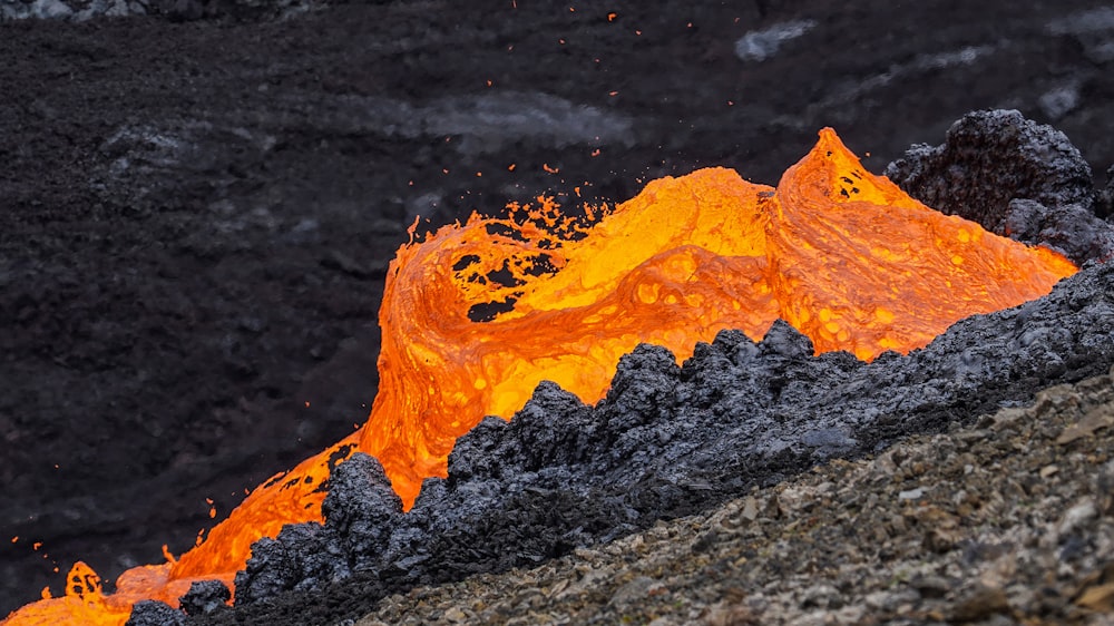 a close up of a mountain with lava coming out of it