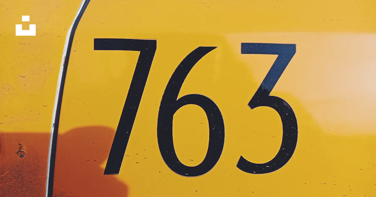 A close up of the numbers on a yellow vehicle photo – Free Digital ...