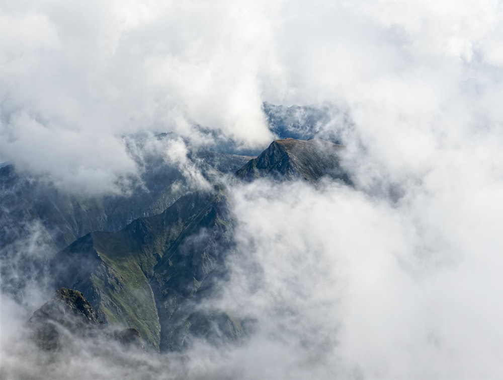 a view of a mountain with a lot of clouds