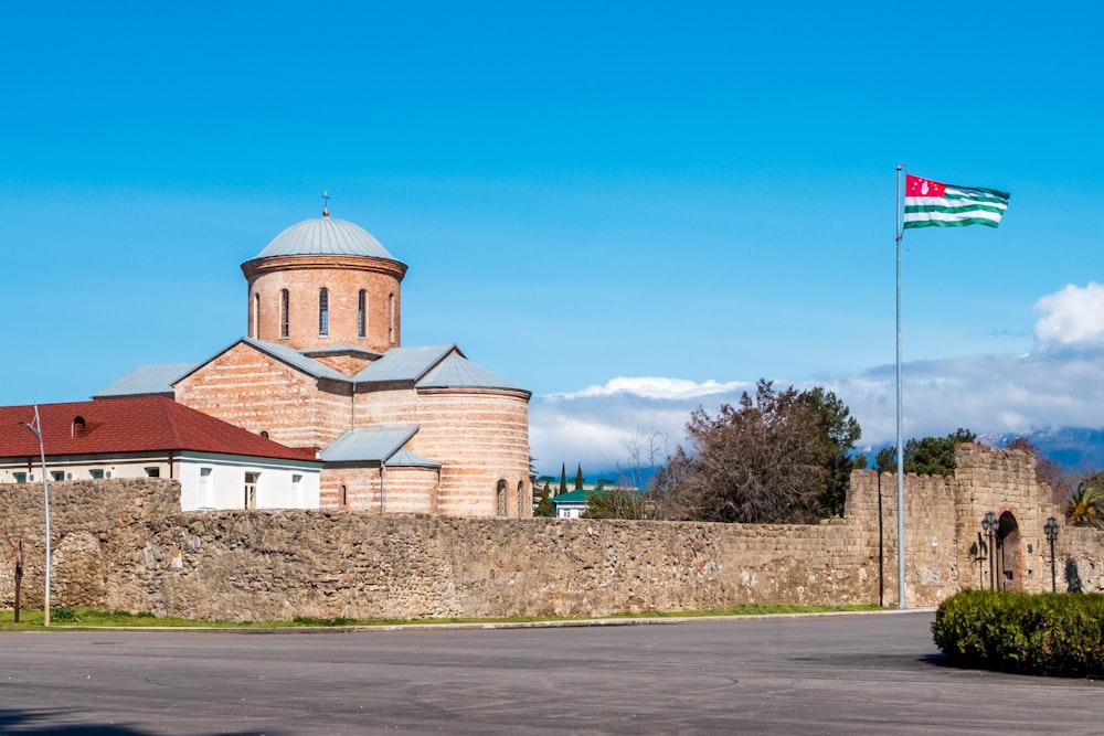 a large building with a flag on top of it