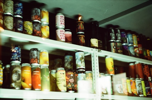 A collection of colorful product packaging on a shelf.
