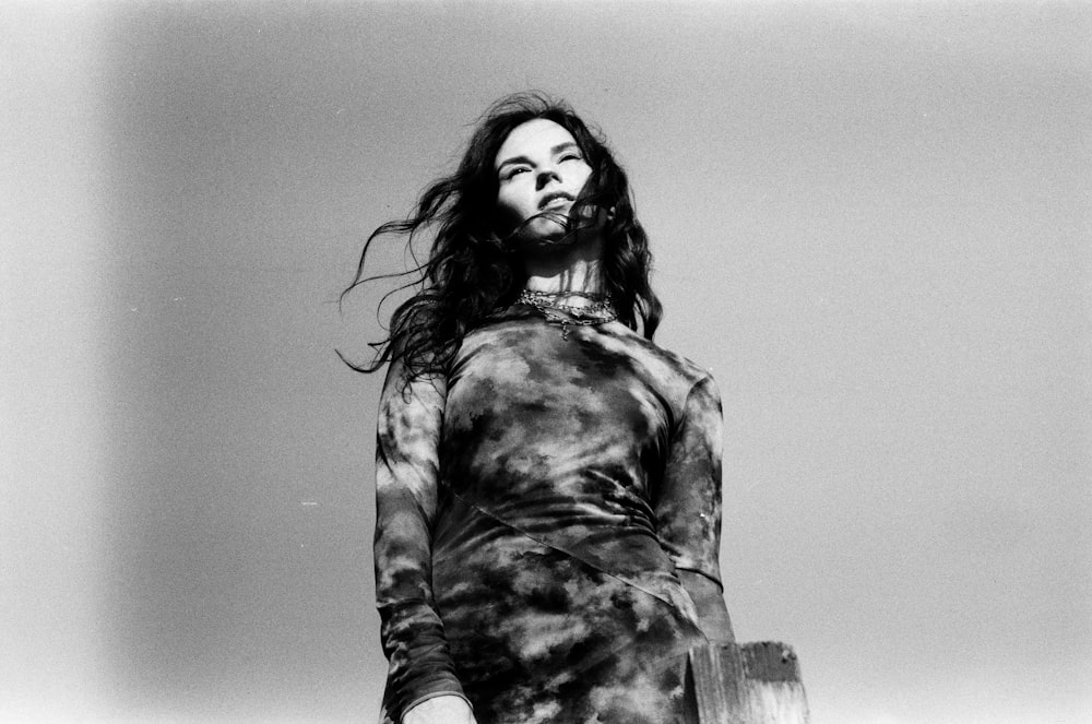 a black and white photo of a woman with long hair