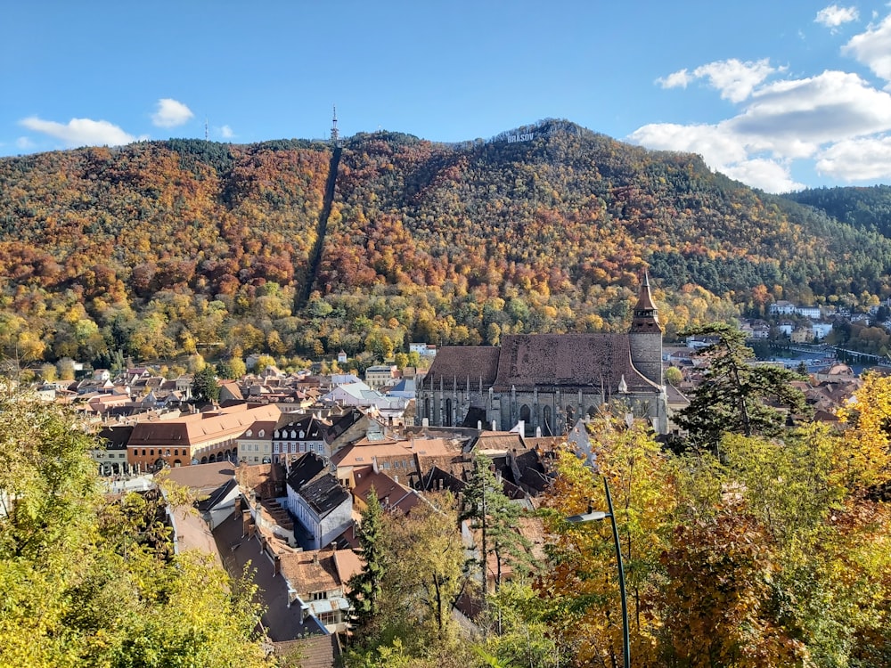 a scenic view of a town in the mountains