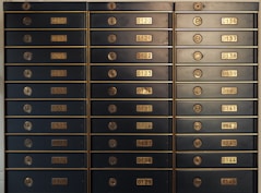 a bunch of mail boxes with numbers on them