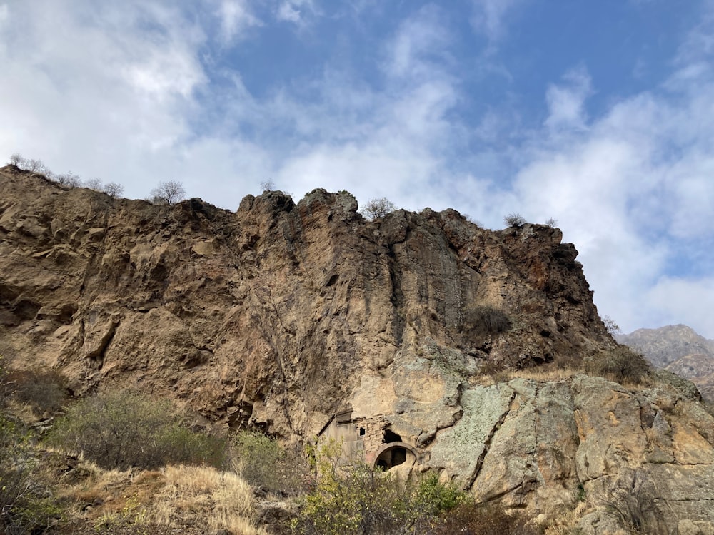 a mountain with a cave in the middle of it