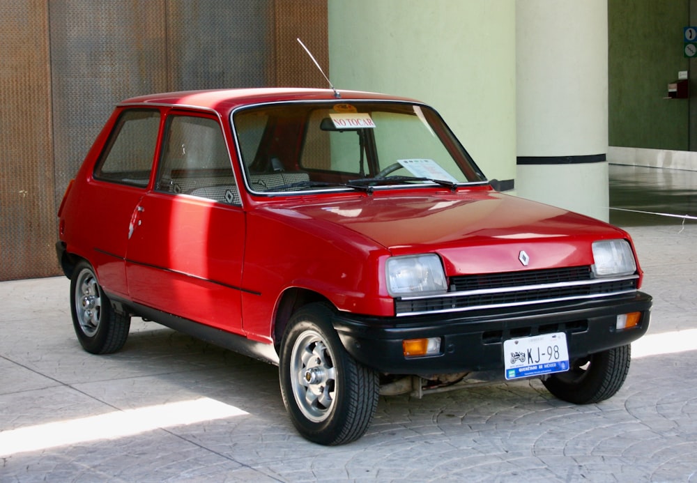 a red car parked on the side of the road