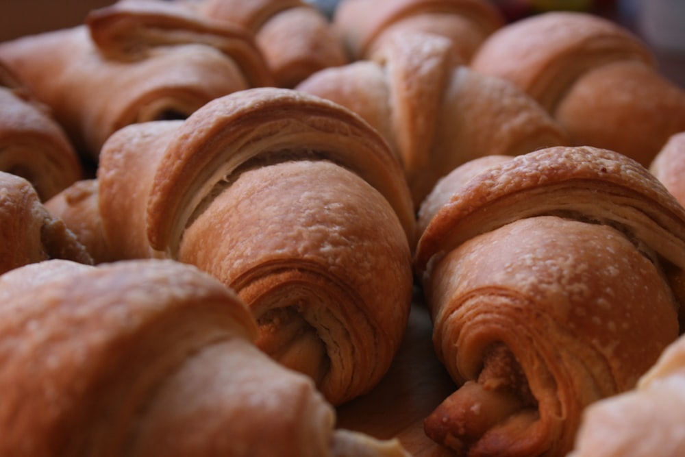 a bunch of croissants sitting on top of a table