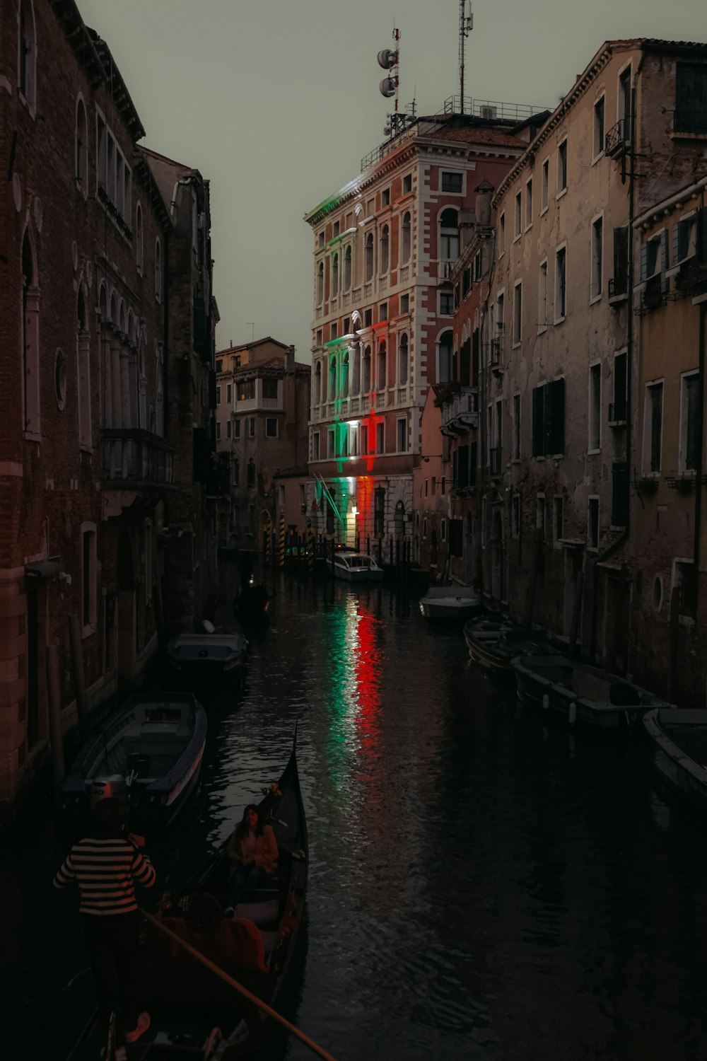 a canal with a row of boats in it