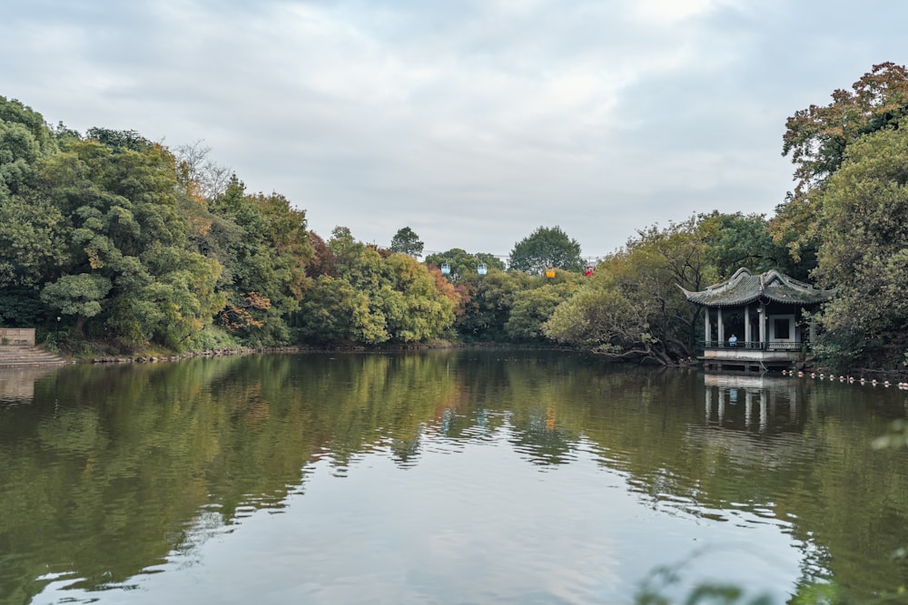 a lake with a pavilion in the middle of it