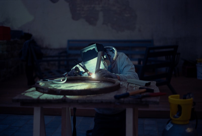 Bench grinder with sparks in a metalworking workshop