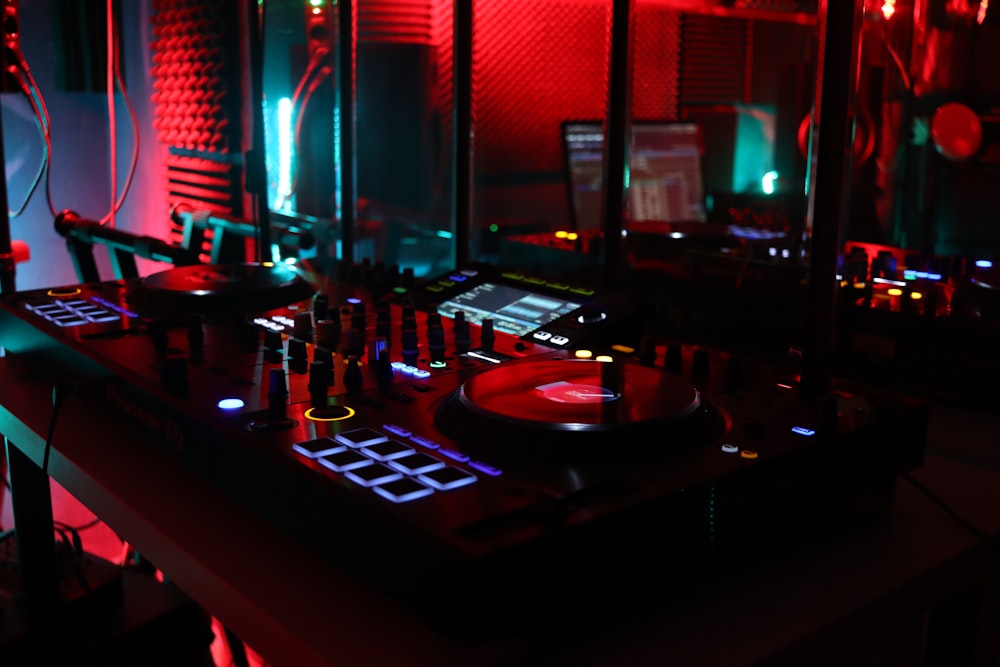 a dj's turntable in a dimly lit room