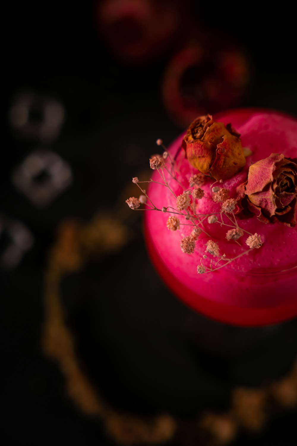 a close up of a drink with flowers in it