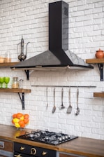 a kitchen with a stove top oven next to a counter