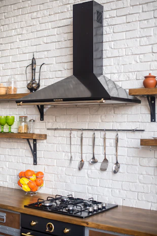 a kitchen with a stove top oven next to a counter