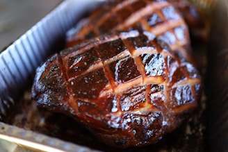 a close up of a pork shoulder in a pan