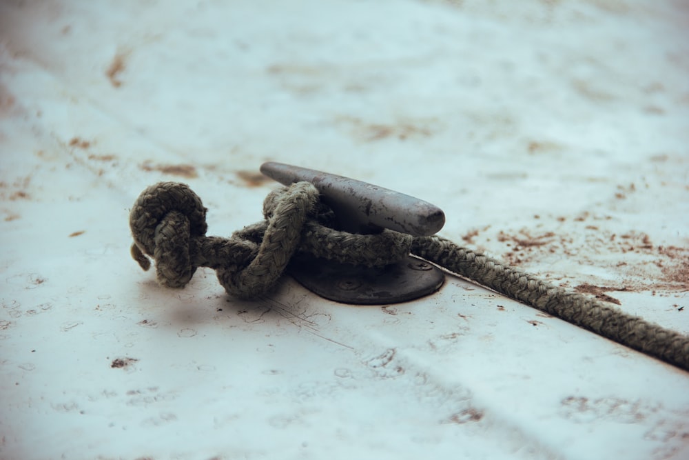 a pair of scissors and a rope laying on the ground
