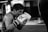 a man in a gym wearing boxing gloves