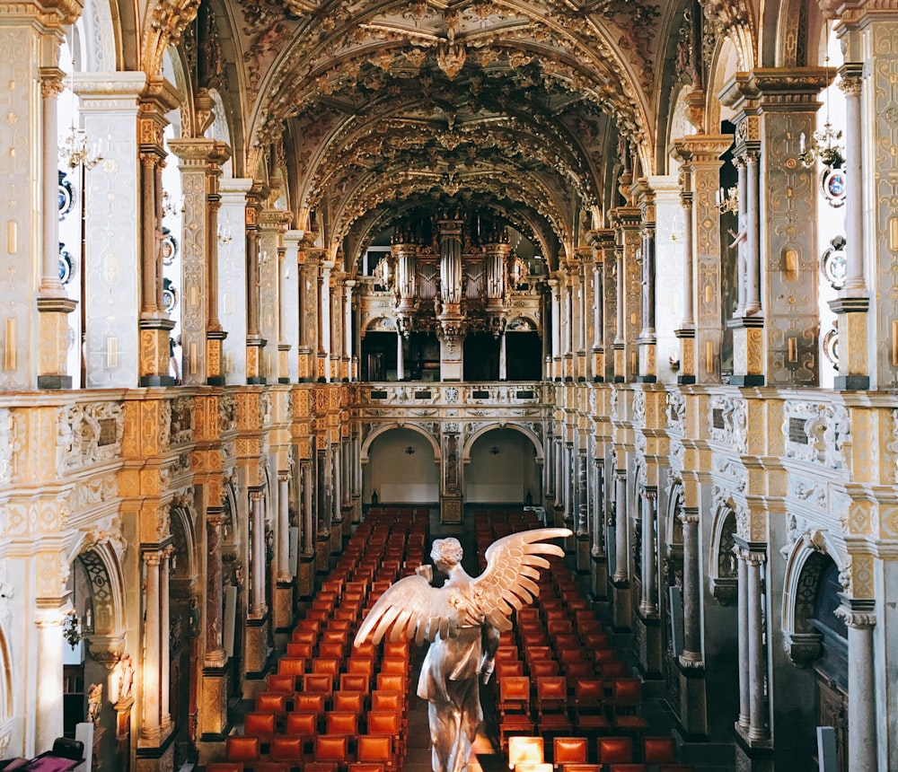 a statue of an angel in a church