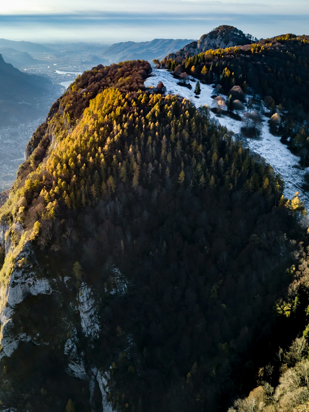 an aerial view of a snow covered mountain