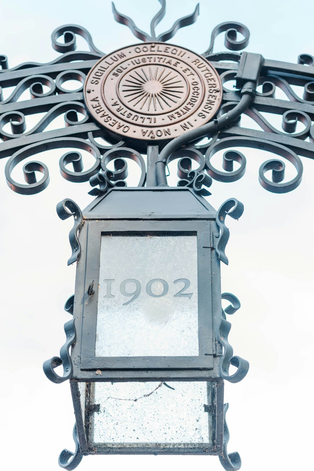 a street light with a clock on top of it