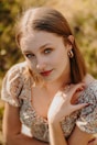 a woman in a dress posing for a picture