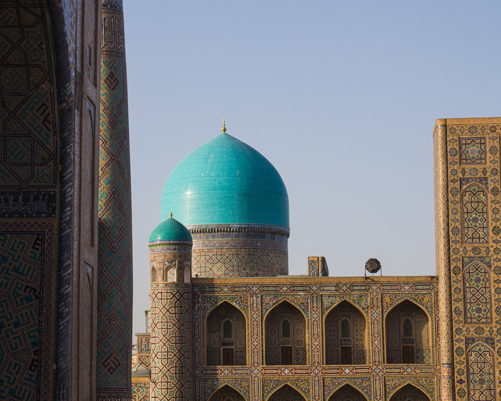 a large building with a blue dome on top of it