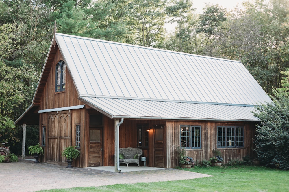 a small wooden building with a metal roof