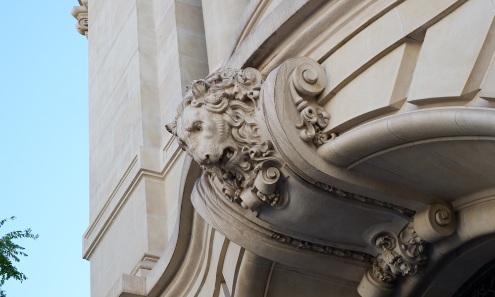 a close up of a building with a clock on the front of it