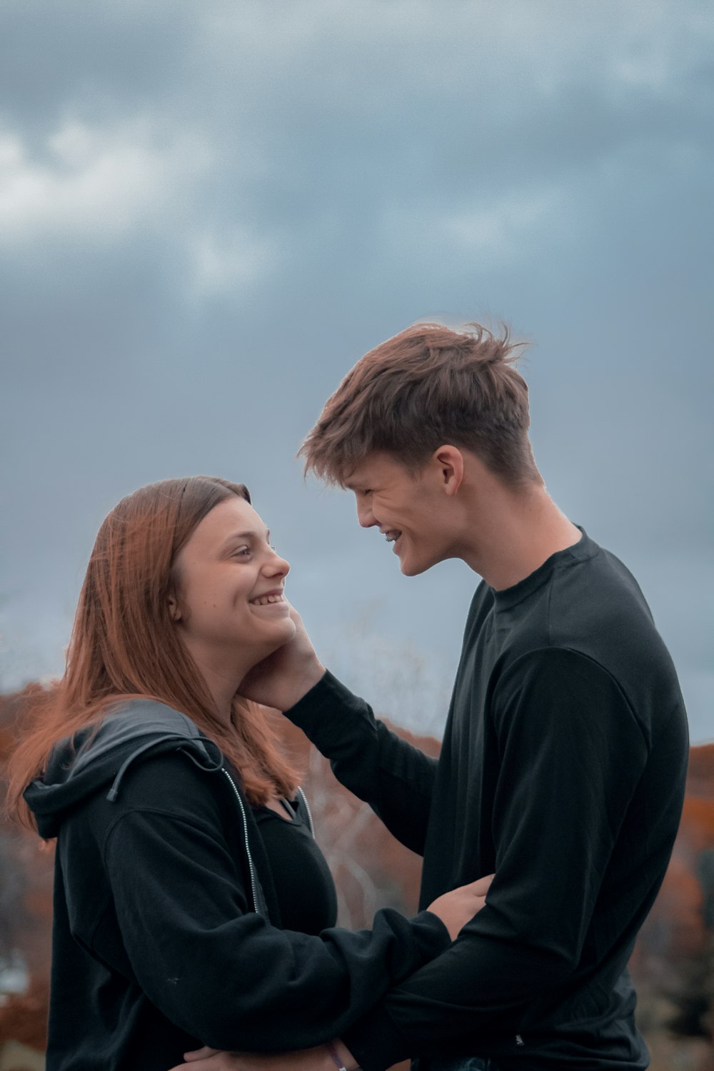 a man and a woman standing next to each other