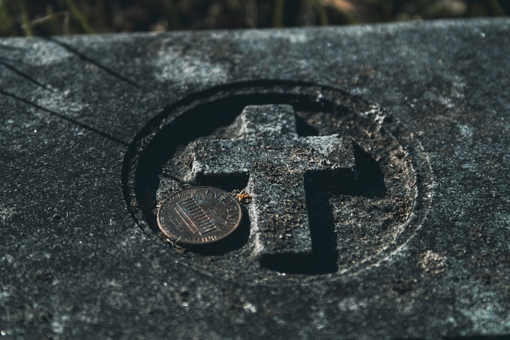 a coin sitting on top of a cement slab