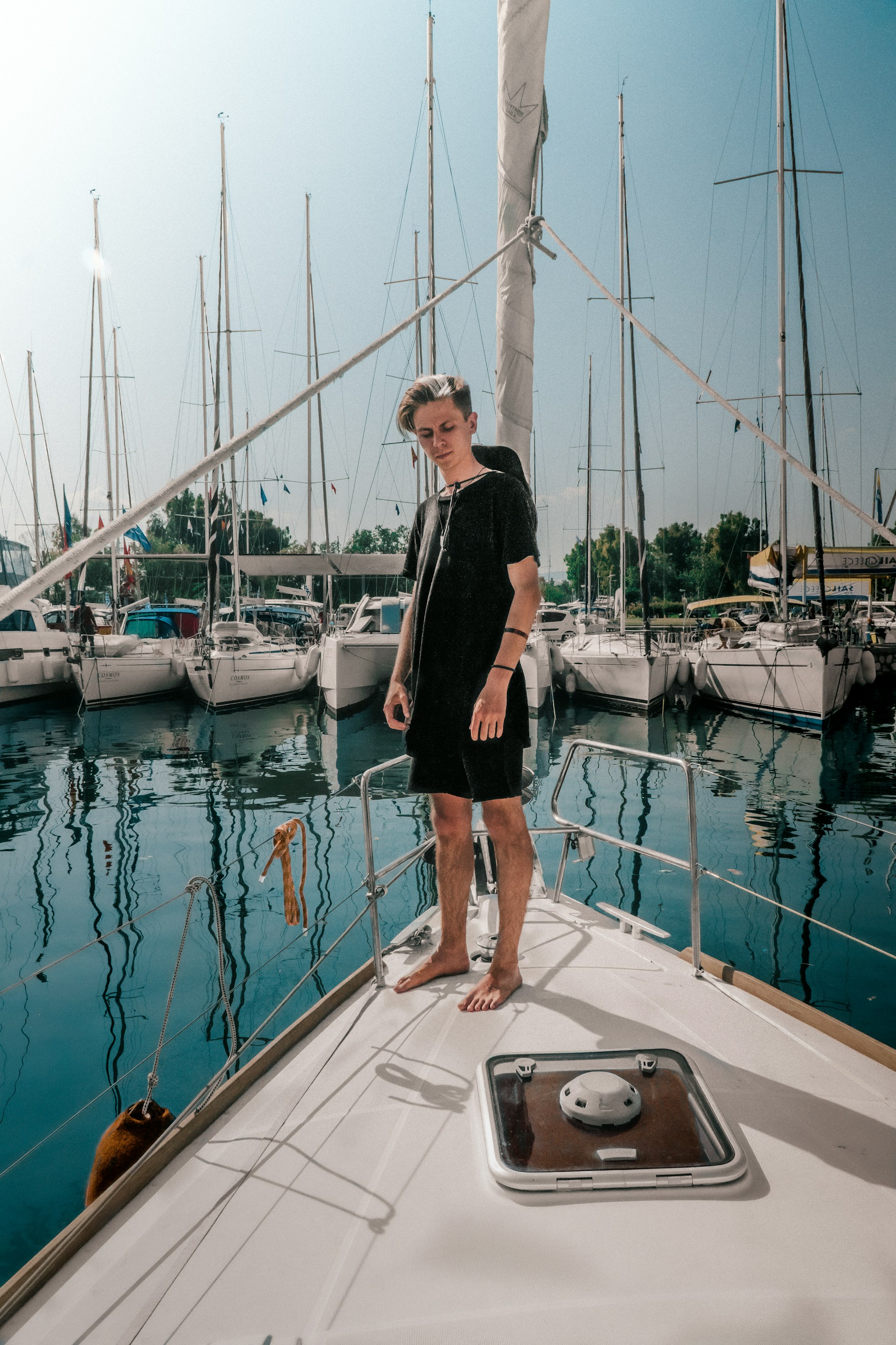a man standing on a boat in the water